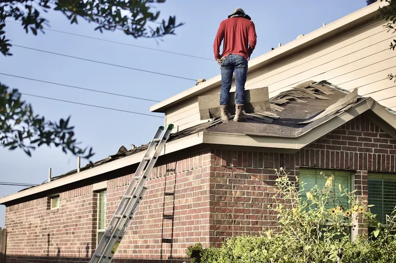 Professional roofer working on a residential roof in Cabazon
